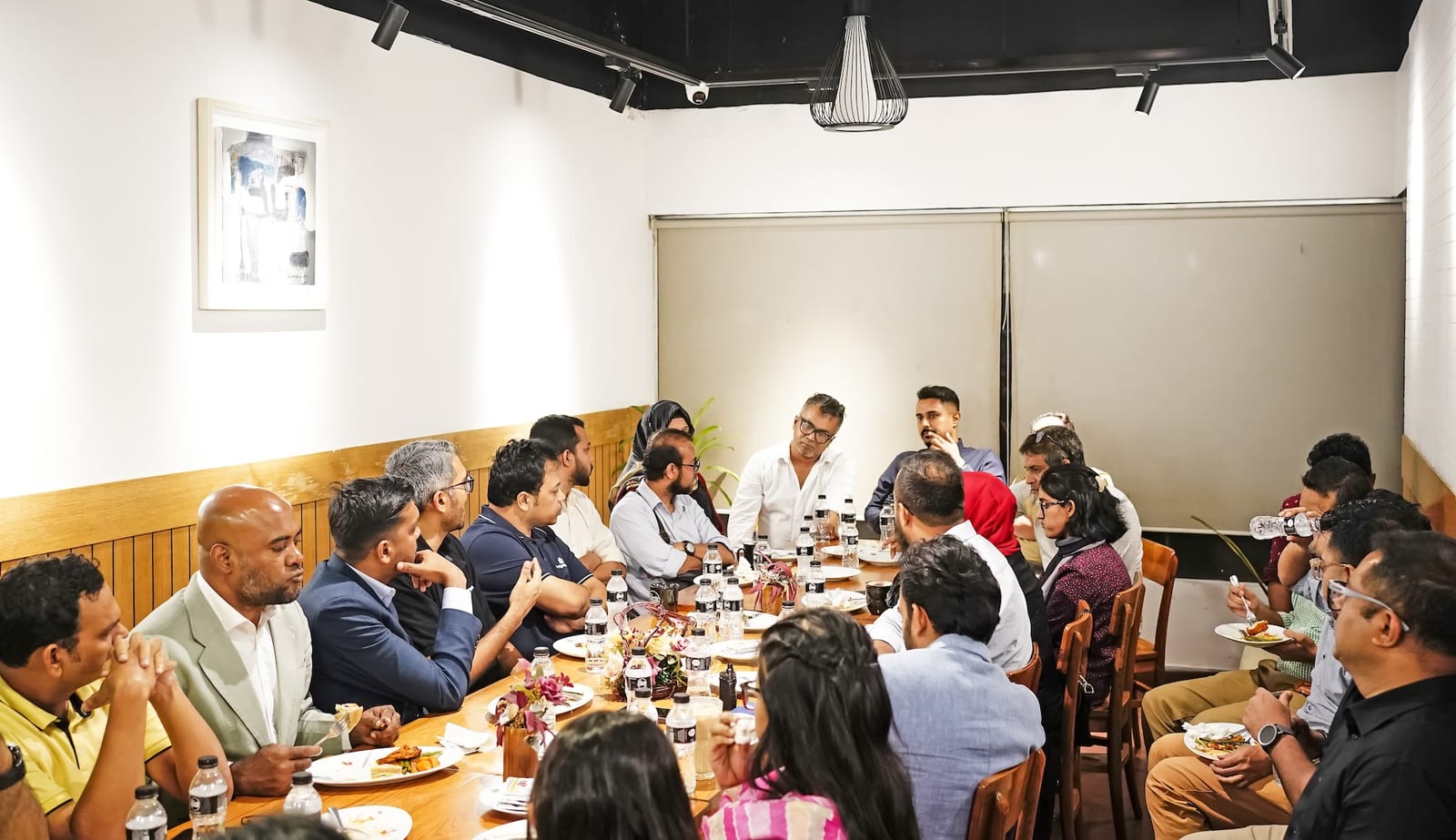 Sharing session around a roundtable to marketers in Dhaka